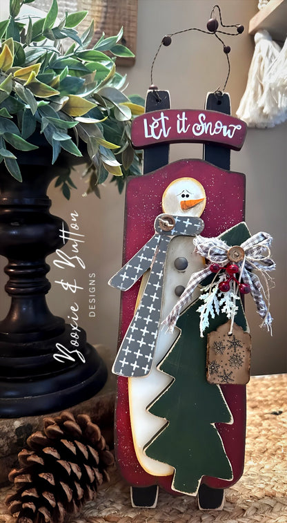 Snowman on a Sled