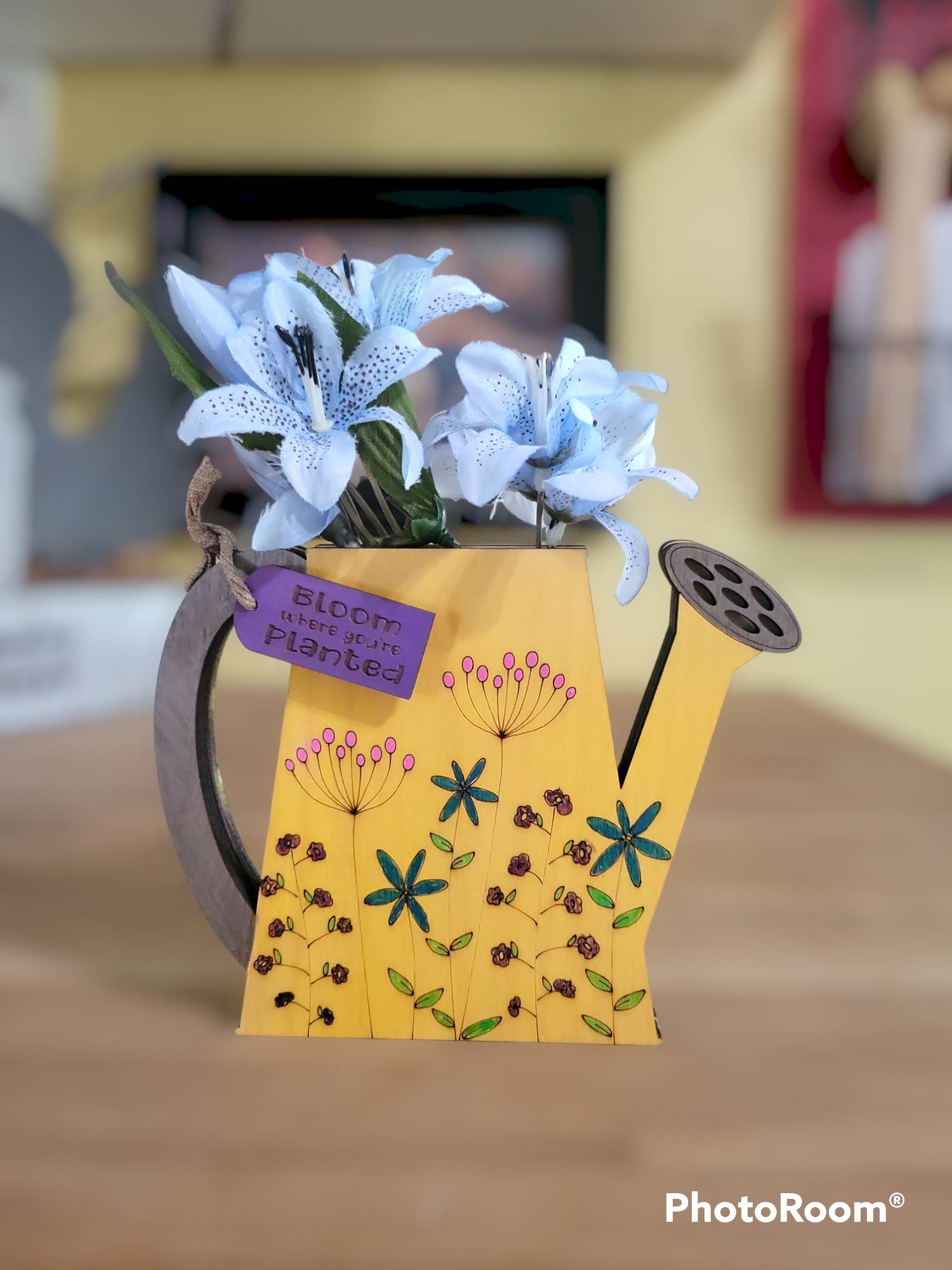 Completed painted wildflower watering can DIY kit with fake flowers